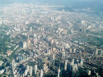 Aerial view of city buildings against sky