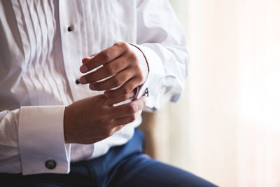 Close-up of man holding hands