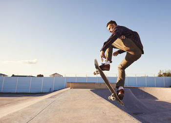 Man skateboarding in skateboard park