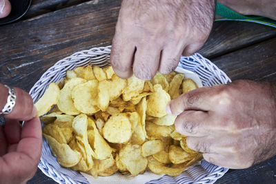 Close-up of man preparing food on table