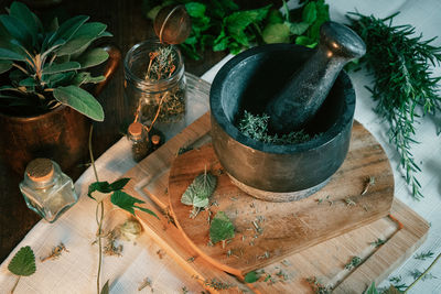 High angle view of mortar and pestle on table