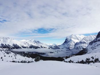 Scenic view of snowcapped mountains against sky