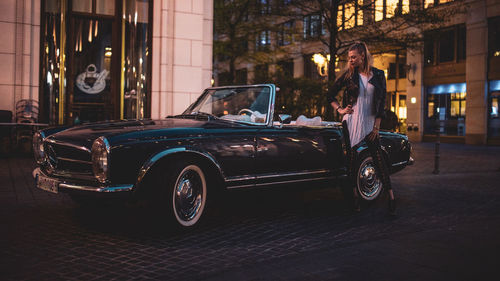 Vintage car on street at night
