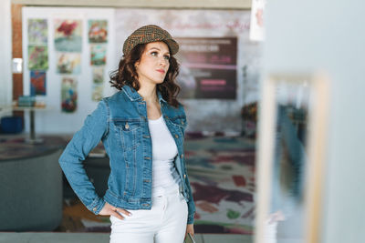 Portrait of beautiful young woman standing outdoors