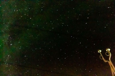 Low angle view of bubbles against star field at night