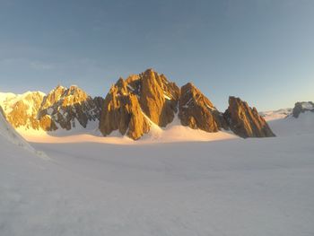 Scenic view of snow covered mountain against sky