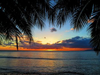 Scenic view of sea against sky at sunset