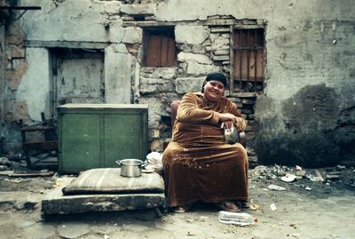 Woman in front of building