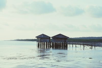 Built structure on beach against sky