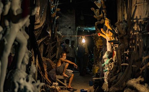 People in illuminated room