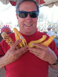 Portrait of smiling man holding ice cream