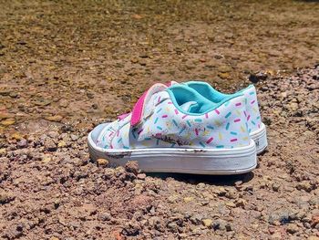 High angle view of shoes on sand