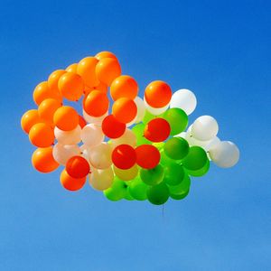 Low angle view of balloons against blue sky