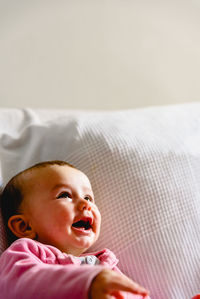 Cute baby boy lying on bed