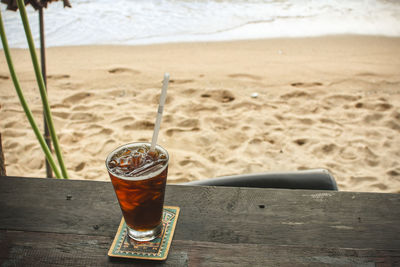 Beer glass on table at beach