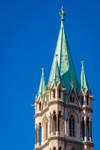 Low angle view of a building against blue sky