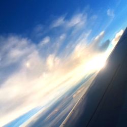 Aerial view of landscape against cloudy sky