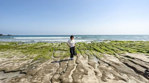 Woman standing on the rick