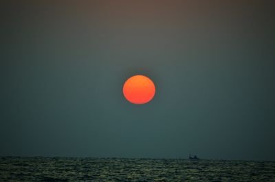 Scenic view of sea against clear sky at night