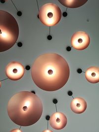 Illuminated pendant lights hanging from ceiling