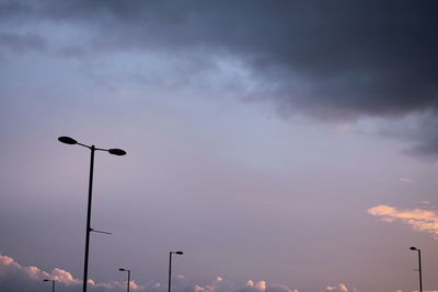 Low angle view of street light against sky