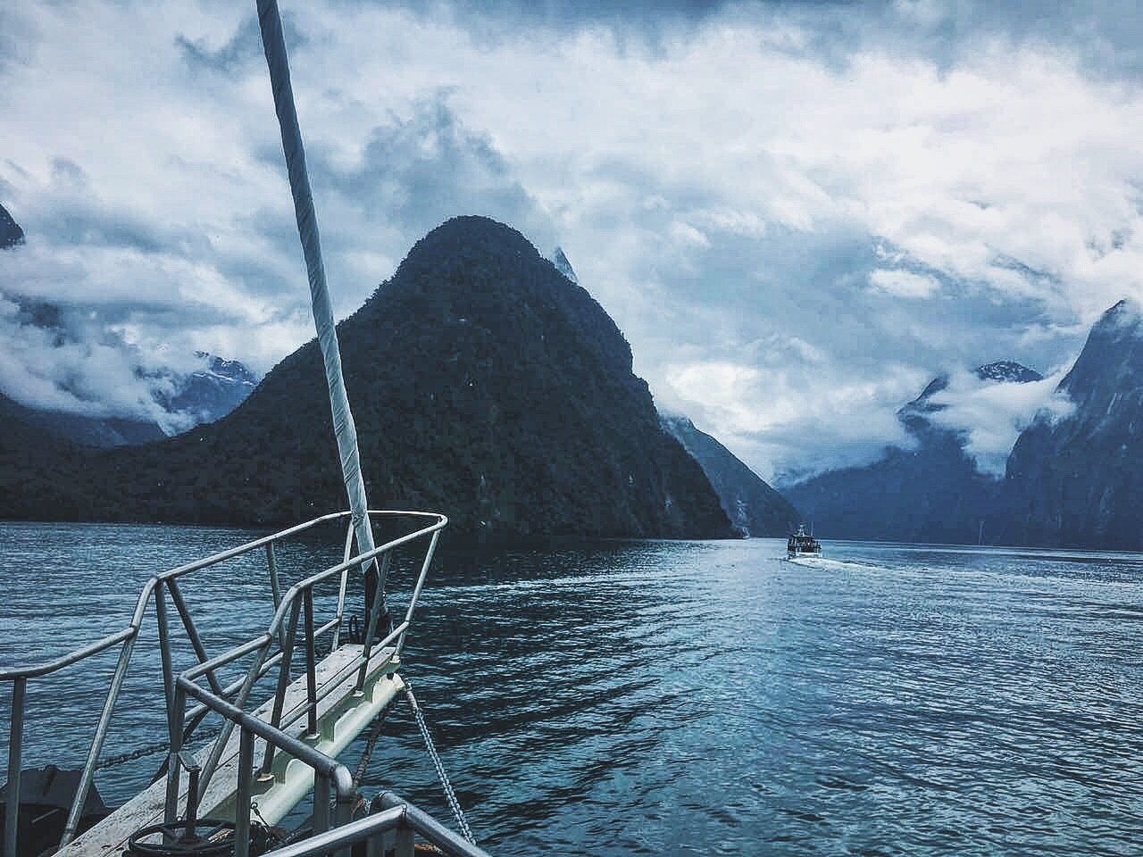 water, mountain, scenics, tranquil scene, sky, rippled, cloud - sky, tranquility, sea, beauty in nature, lake, waterfront, nature, non-urban scene, majestic, mountain range, cloud, sailboat, branch, calm, day, cloudy, outdoors, no people, tourism, cloudscape