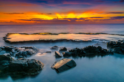 Scenic view of sea against sky during sunset