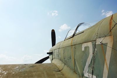 Abandoned airplane against blue sky