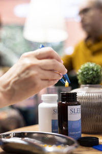 Cropped hand of man holding drink