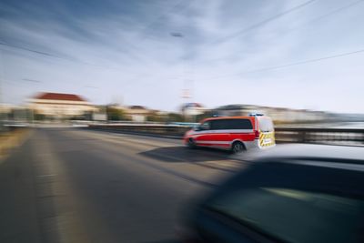 Car on road seen through windshield