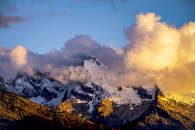 Scenic view of landscape against cloudy sky