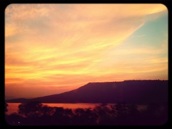 Scenic view of mountains at sunset