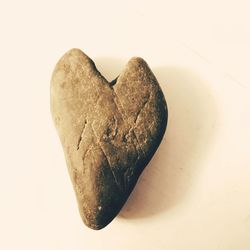 Close-up of heart shape over white background