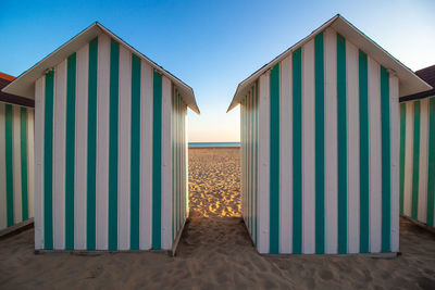 Beach huts against sky