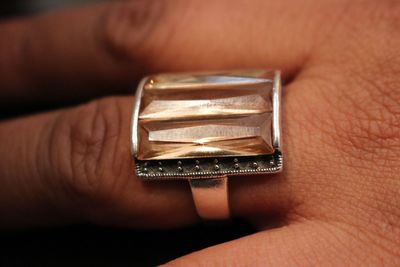 Close-up of person holding ring