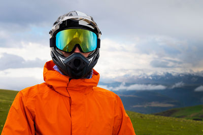 Rear view of man standing against mountain