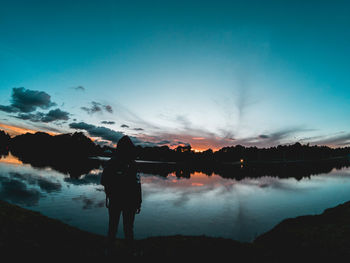 Siluete of a man looking the sunset