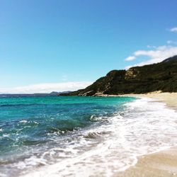 Scenic view of sea against blue sky