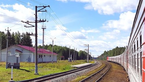 Train on railway tracks against sky