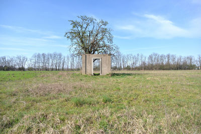 Built structure on landscape against sky