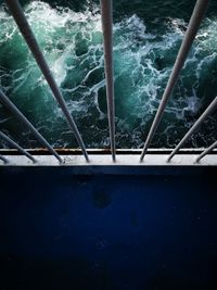 High angle view of swimming pool by wall