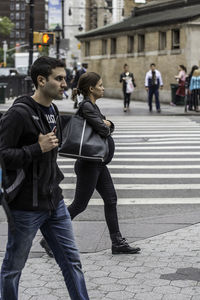 Woman standing on city street