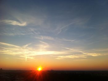 Scenic view of landscape against sky during sunset