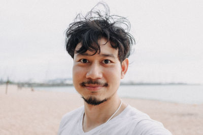 Portrait of young man on beach