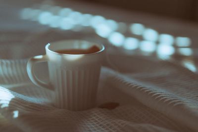 Close-up of coffee cup on table