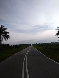 Empty road along landscape