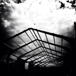 Low angle view of building against cloudy sky