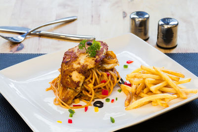 High angle view of pasta served in plate on table