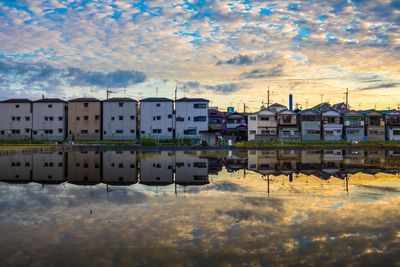 Buildings in city at sunset