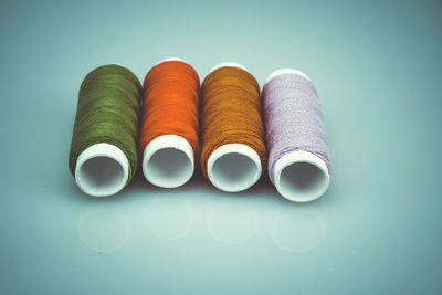 Close-up of multi colored pencils over white background